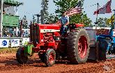 George Webster driving the International 1256 in the 12,000 lb Stock Tractor class
